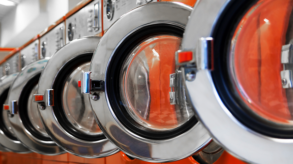 Laundry machines with their doors open